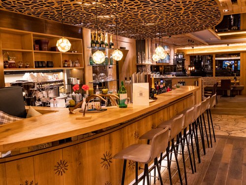 Hotel Sonnenhof Cozy bar with wooden counter and decorative ceiling lighting